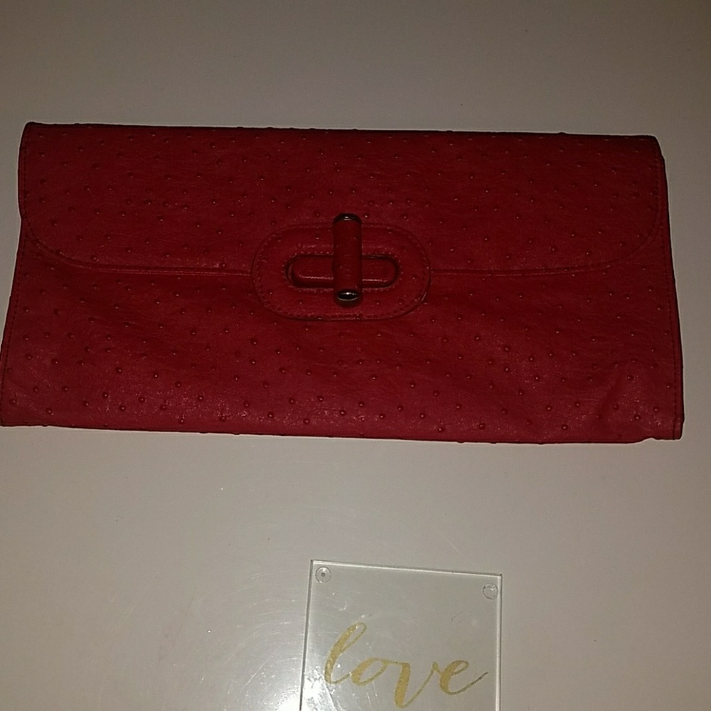 Red clutch with textured pattern